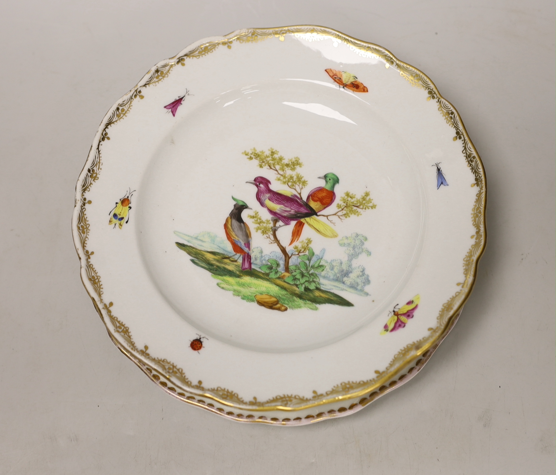 Five 19th century Meissen porcelain items including three plates, a dish and a cup and saucer, most items outside decorated, largest plate 23.5cm